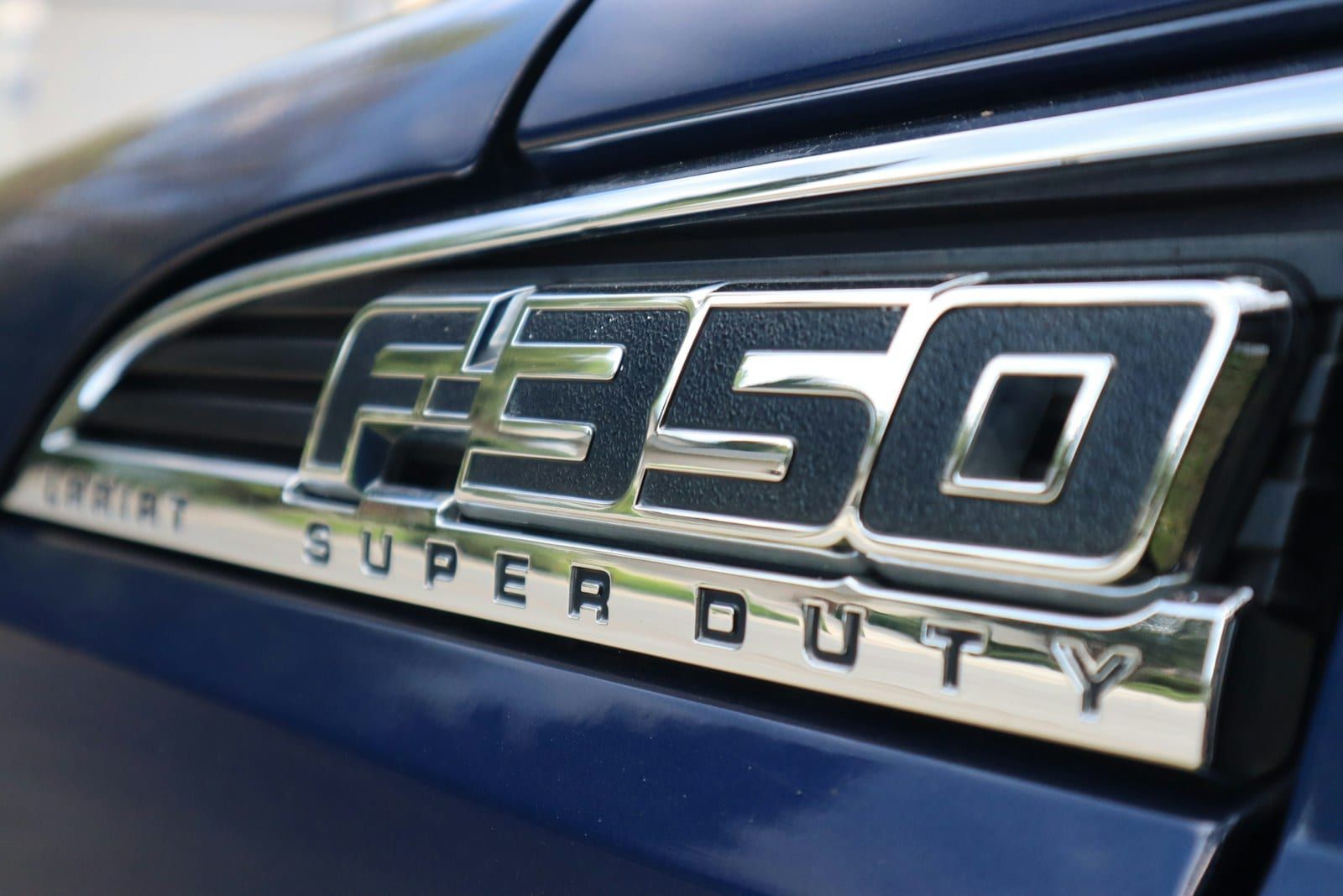 Ford F-350 Super Duty badge close-up on a blue body panel